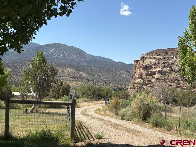 12299 Rd G Cortez, CO 81321 - Photo 35 of 44 a view of a lake with a mountain in the background