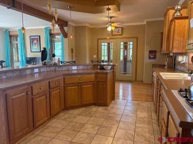 12299 Rd G Cortez, CO 81321 - Photo 7 of 44 a large kitchen with stainless steel appliances a stove sink and cabinets