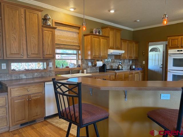 12299 Rd G Cortez, CO 81321 - Photo 10 of 44 a kitchen with stainless steel appliances granite countertop a stove a sink dishwasher and cabinets