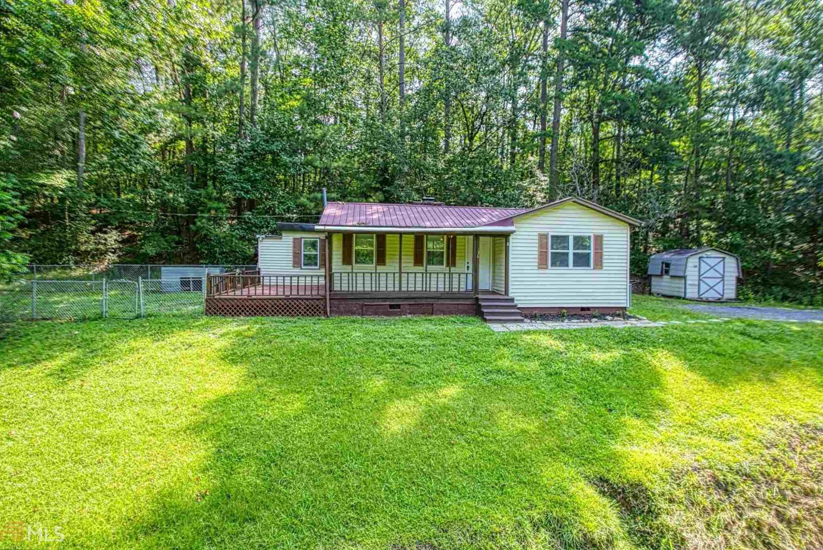 136 Peel Road Northeast Rome, GA 30161 - Photo 1 of 1 a view of a house with a backyard