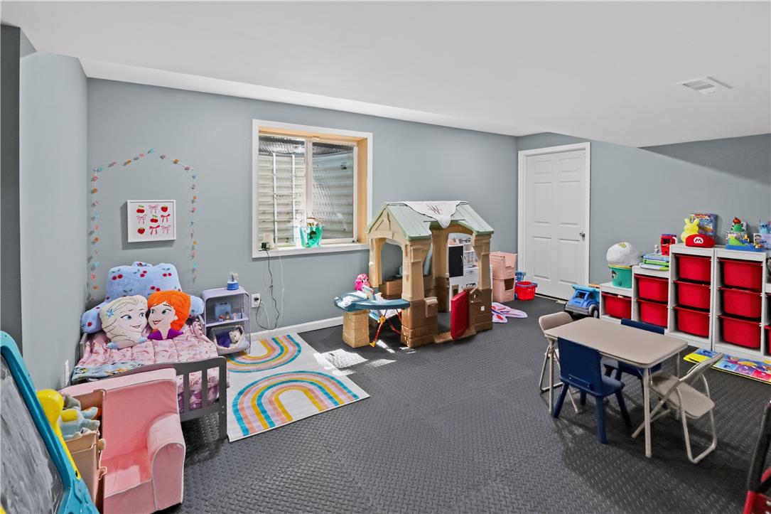 4502 Benjamin Court Emmaus, PA 18049 - Photo 41 of 48 A well-lit play area, perfect for children, features a bright window and a durable floor.