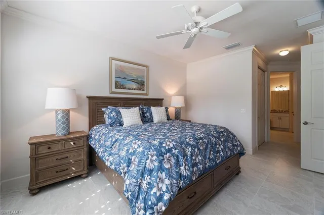 a bedroom with a bed and a lamp