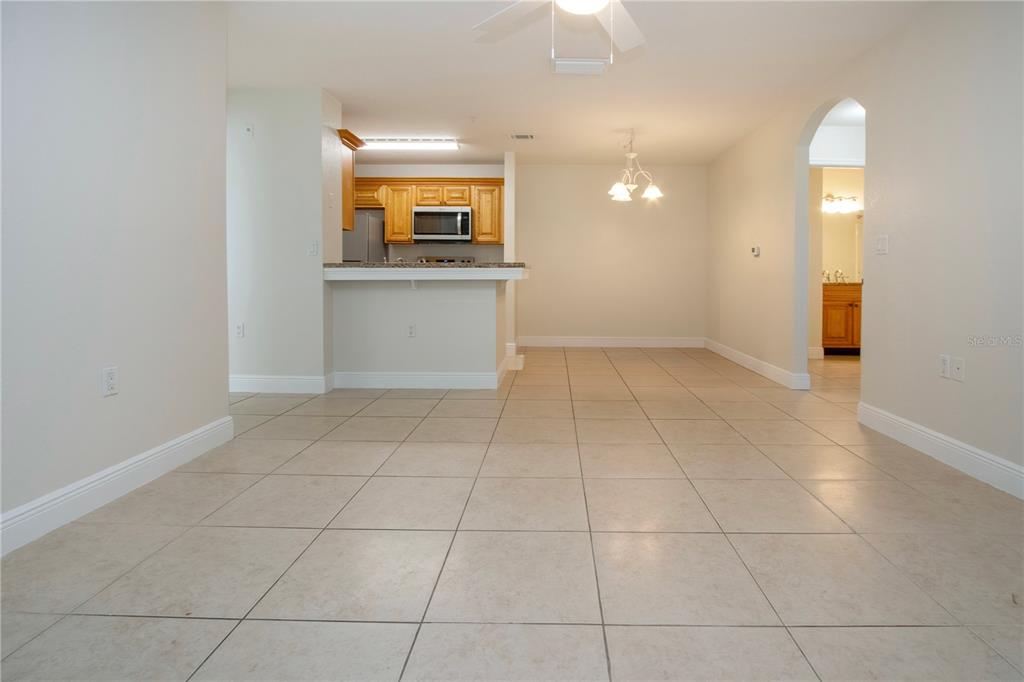 8926 Manor Loop, Unit 107 Lakewood Ranch, FL 34202 - Photo 12 of 44 a view of a kitchen with an empty space and a window
