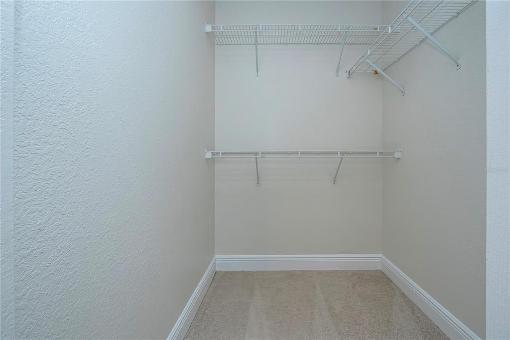 8926 Manor Loop, Unit 107 Lakewood Ranch, FL 34202 - Photo 15 of 44 a view of a room with racks on the wall