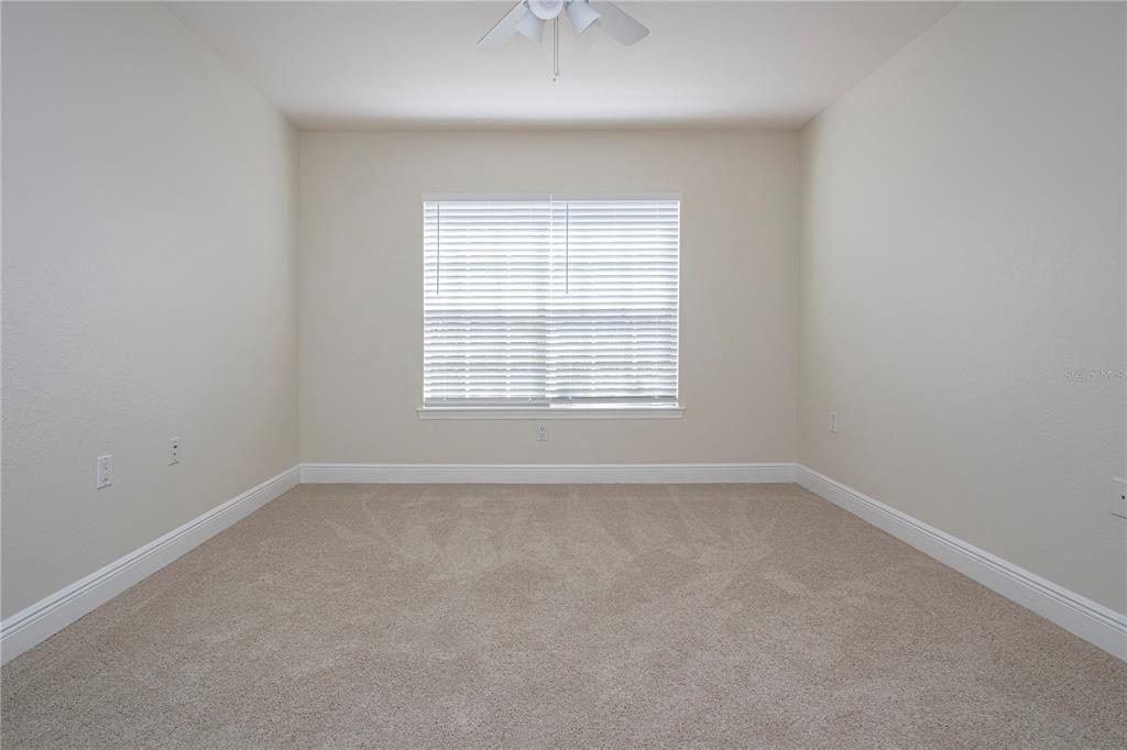 8926 Manor Loop, Unit 107 Lakewood Ranch, FL 34202 - Photo 22 of 44 an empty room with a window