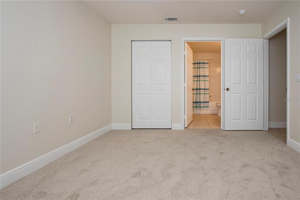 8926 Manor Loop, Unit 107 Lakewood Ranch, FL 34202 - Photo 23 of 44 an empty room with closet area