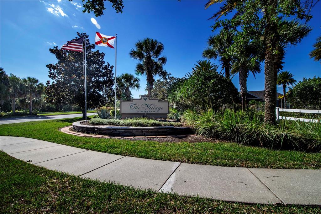 8926 Manor Loop, Unit 107 Lakewood Ranch, FL 34202 - Photo 34 of 44 a view of a garden with plants
