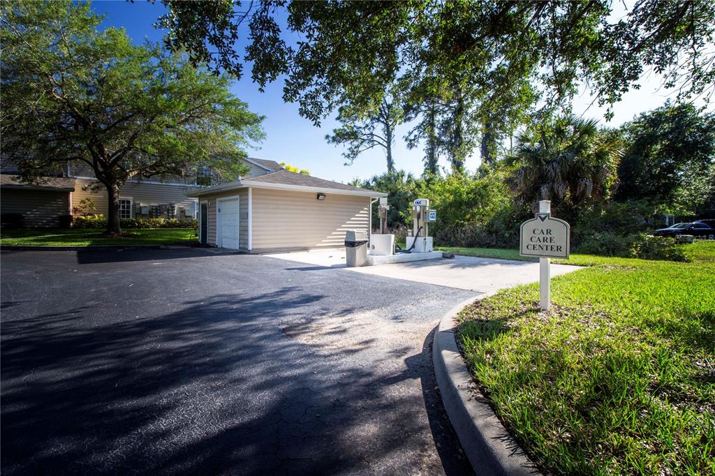 8926 Manor Loop, Unit 107 Lakewood Ranch, FL 34202 - Photo 44 of 44 a street view with a garden