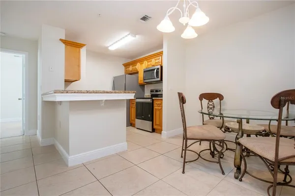 a kitchen with a sink and a refrigerator