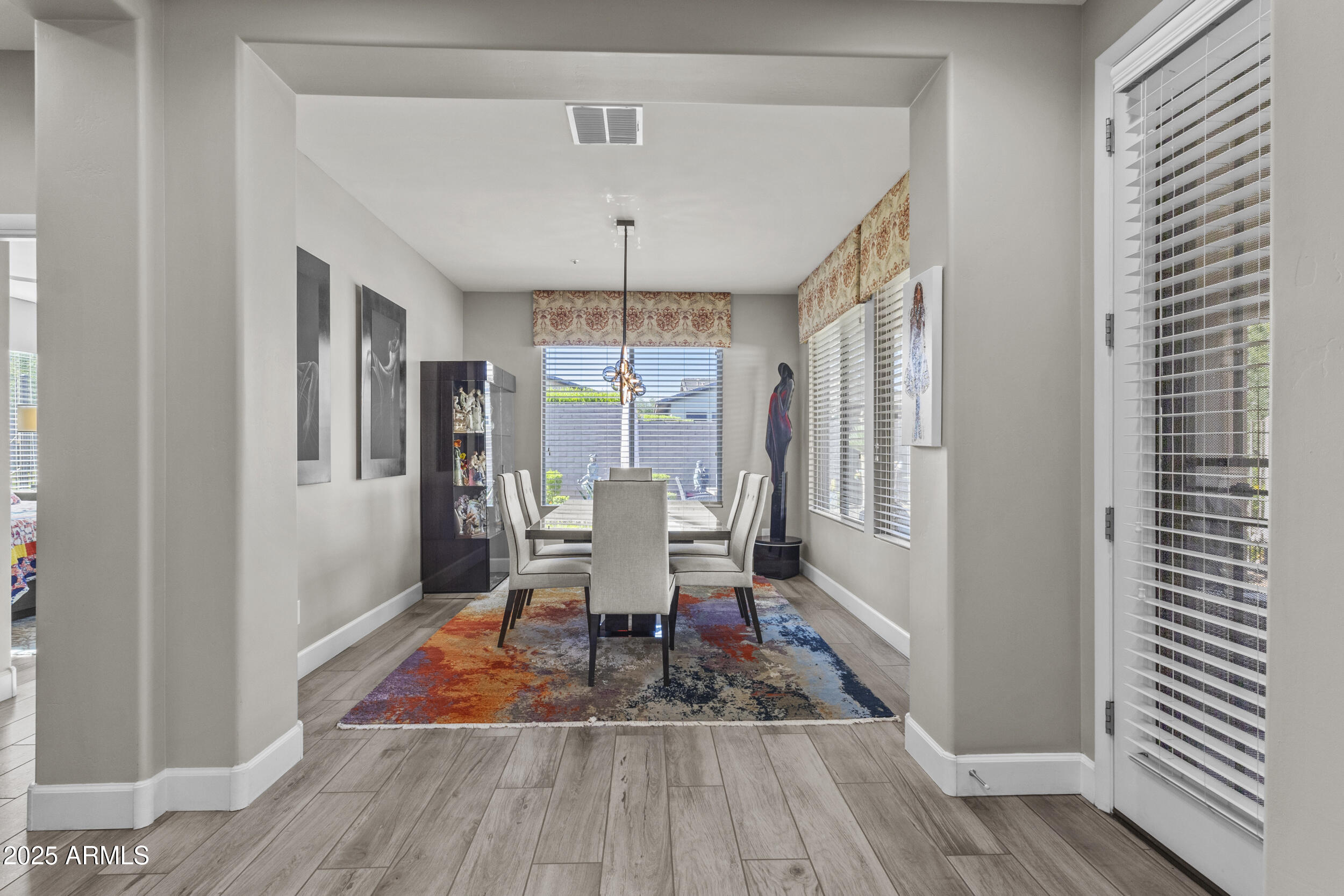 18068 East Curva De Plata Rio Verde, AZ 85263 - Photo 20 of 71 a living room with furniture and a wooden floor