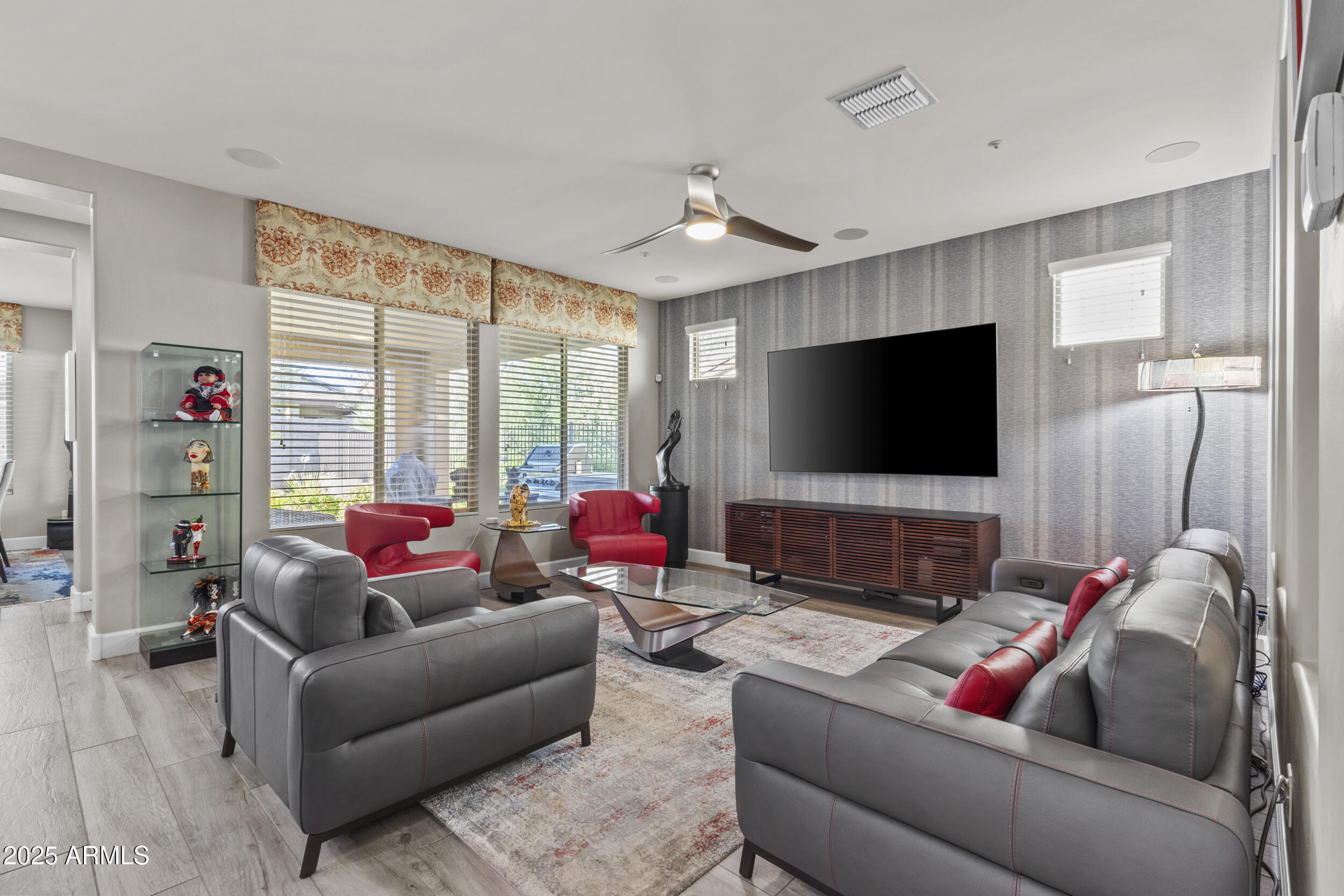 18068 East Curva De Plata Rio Verde, AZ 85263 - Photo 26 of 71 a living room with furniture and a flat screen tv