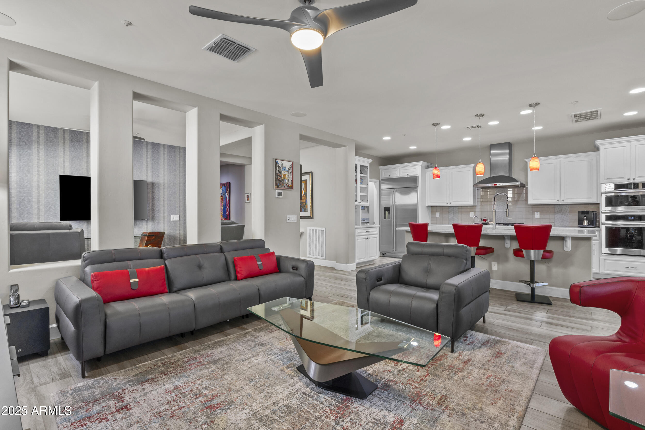 18068 East Curva De Plata Rio Verde, AZ 85263 - Photo 28 of 71 a living room with furniture kitchen view and a flat screen tv