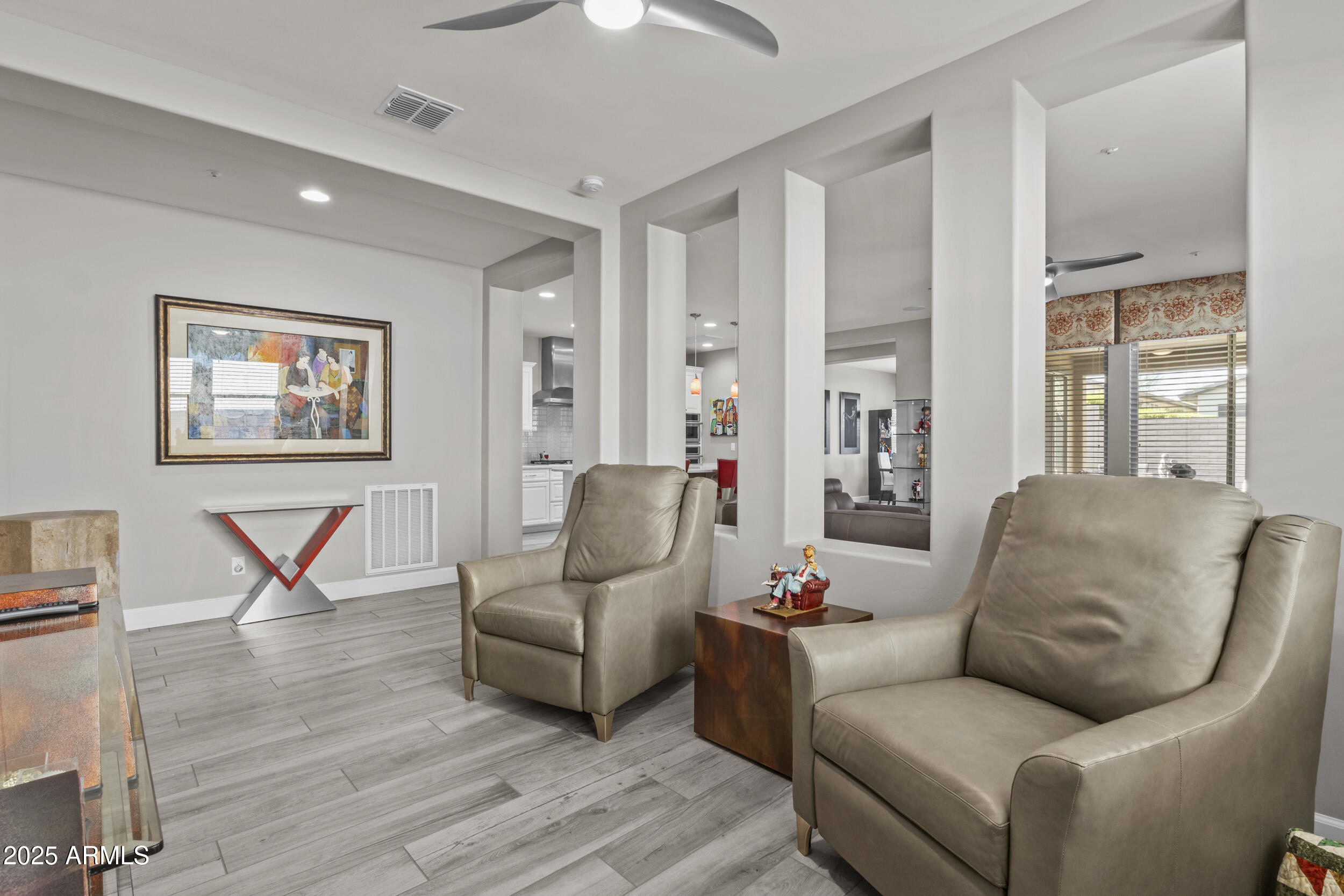 18068 East Curva De Plata Rio Verde, AZ 85263 - Photo 30 of 71 a living room with furniture and a wooden floor