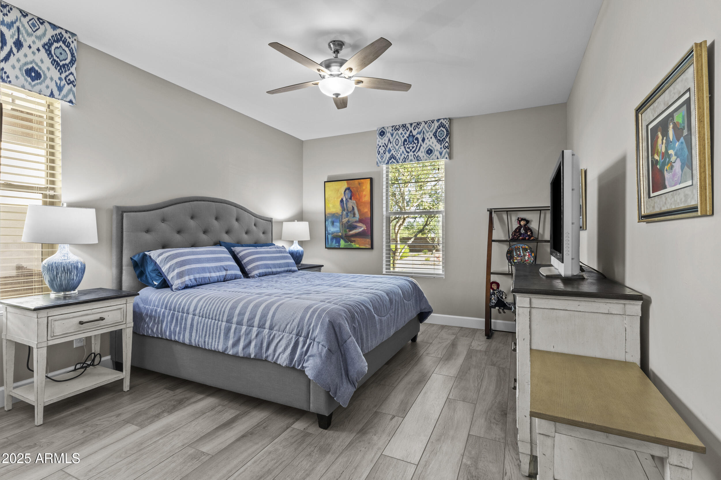 18068 East Curva De Plata Rio Verde, AZ 85263 - Photo 37 of 71 a bedroom with a bed a dresser next to a window