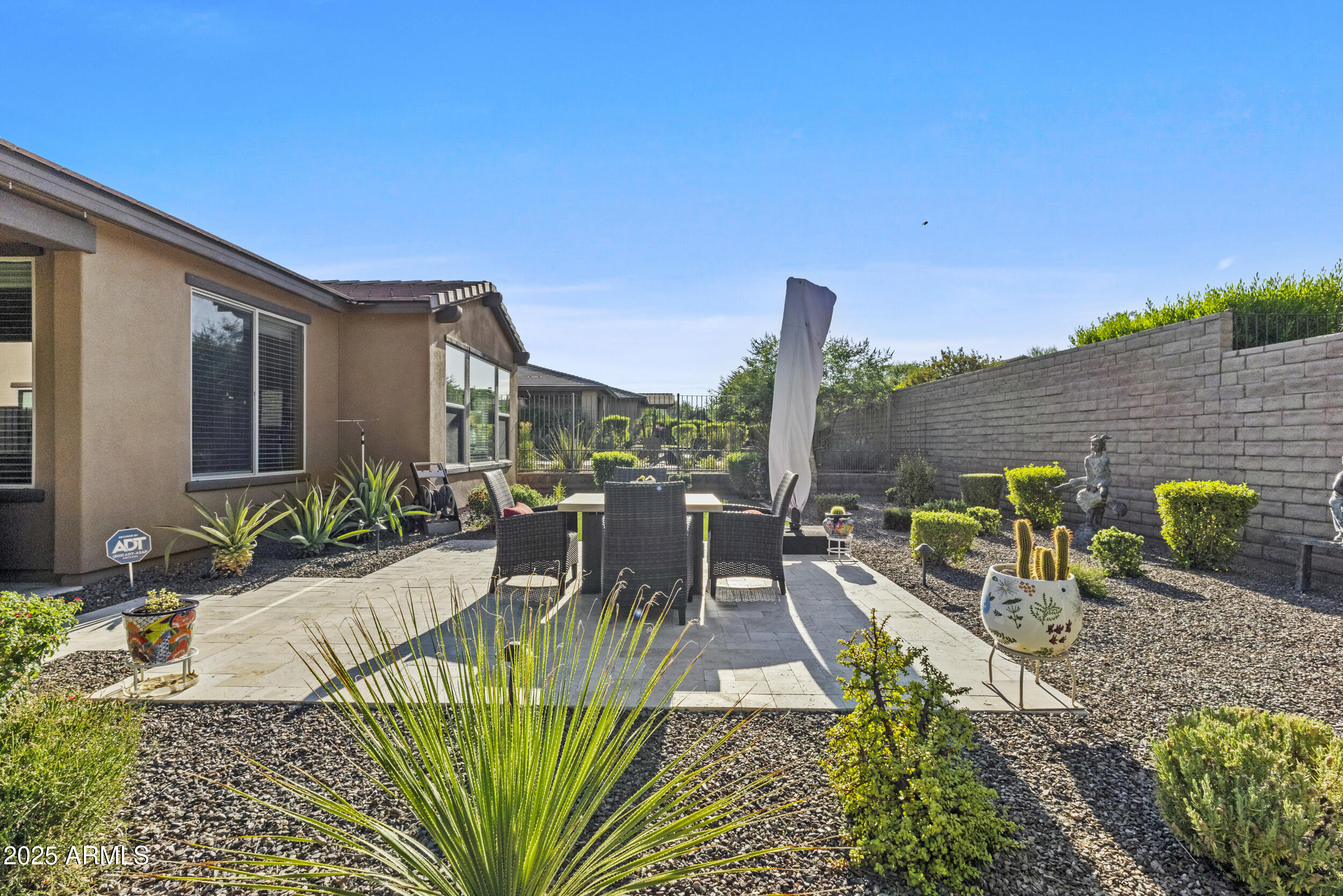 18068 East Curva De Plata Rio Verde, AZ 85263 - Photo 41 of 71 a view of a patio with chairs and plants