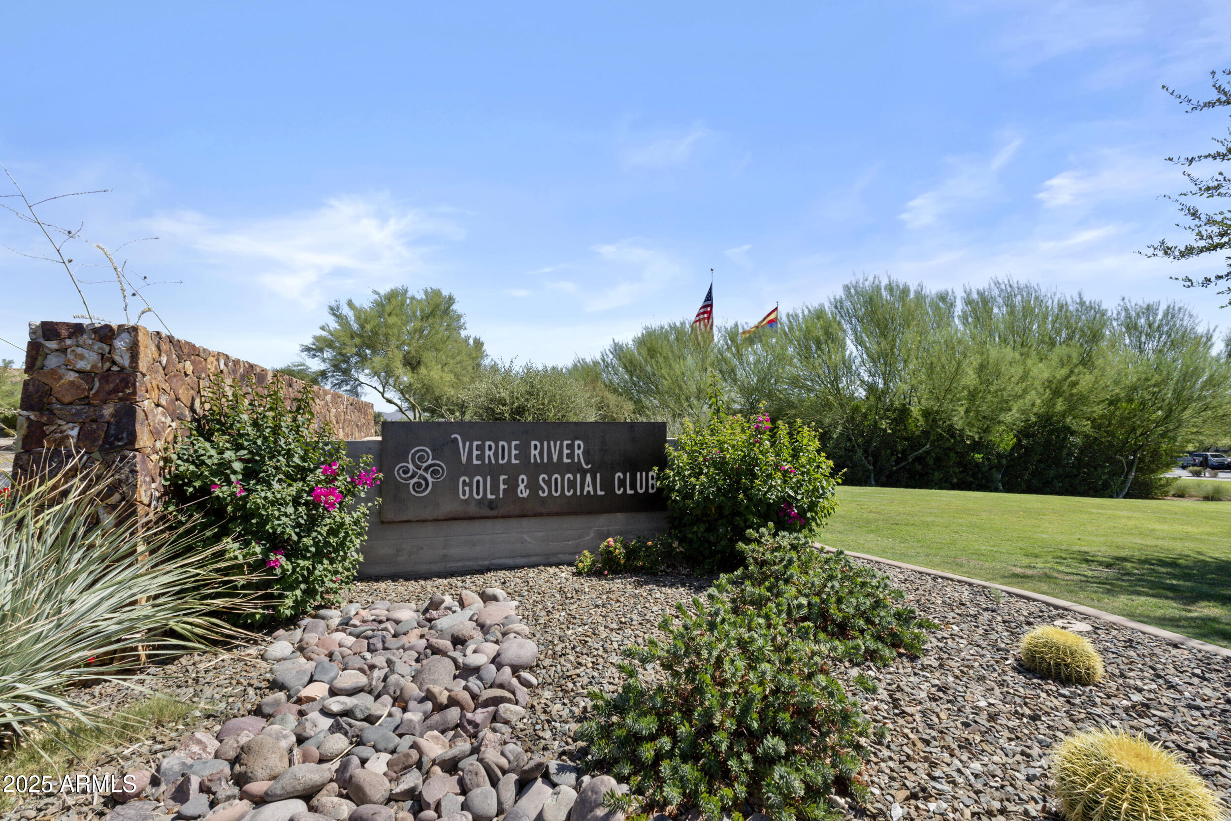 18068 East Curva De Plata Rio Verde, AZ 85263 - Photo 50 of 71 a sign that is sitting in front of flowers