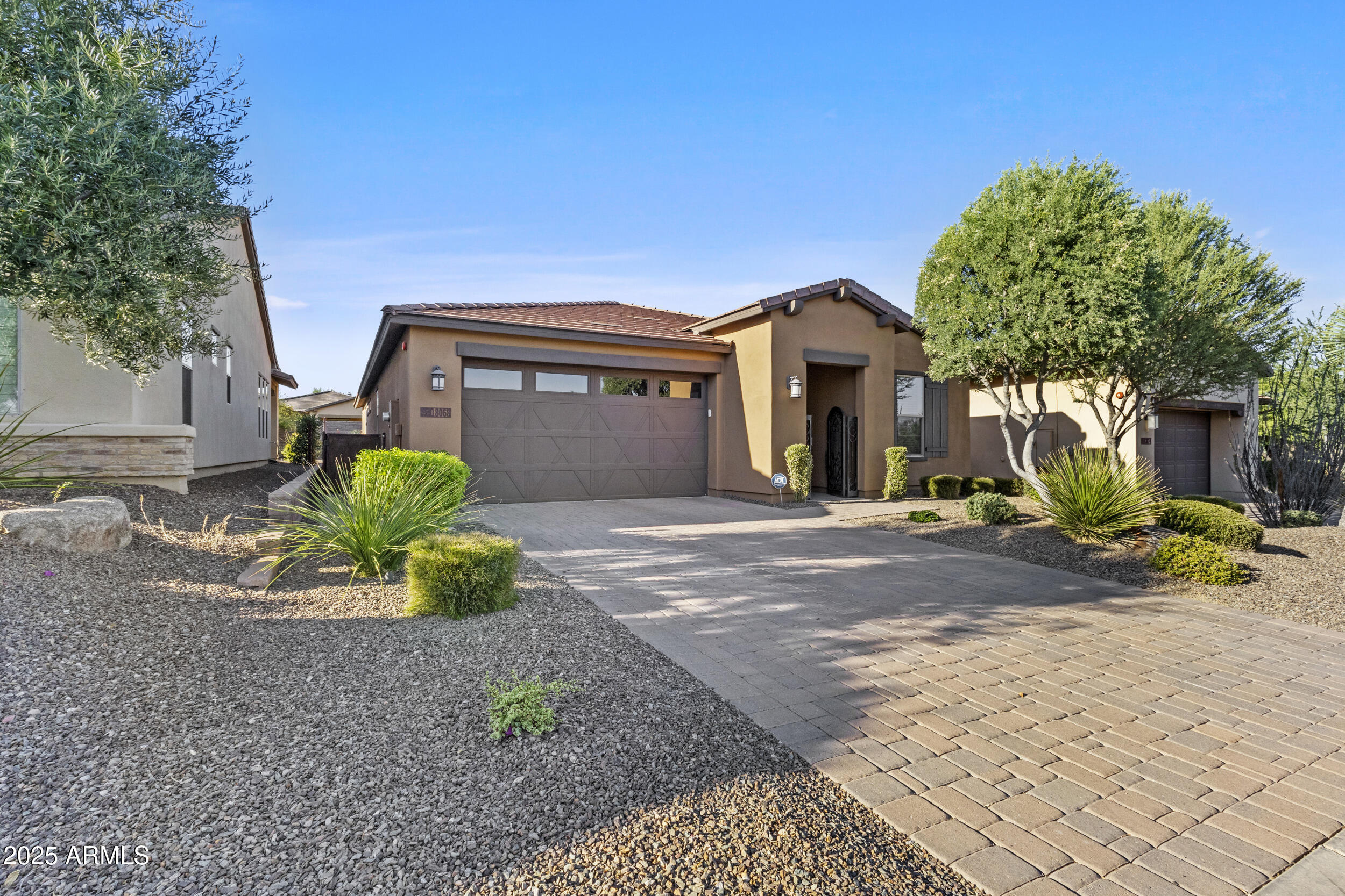 18068 East Curva De Plata Rio Verde, AZ 85263 - Photo 6 of 71 a front view of a house with a yard and a garage