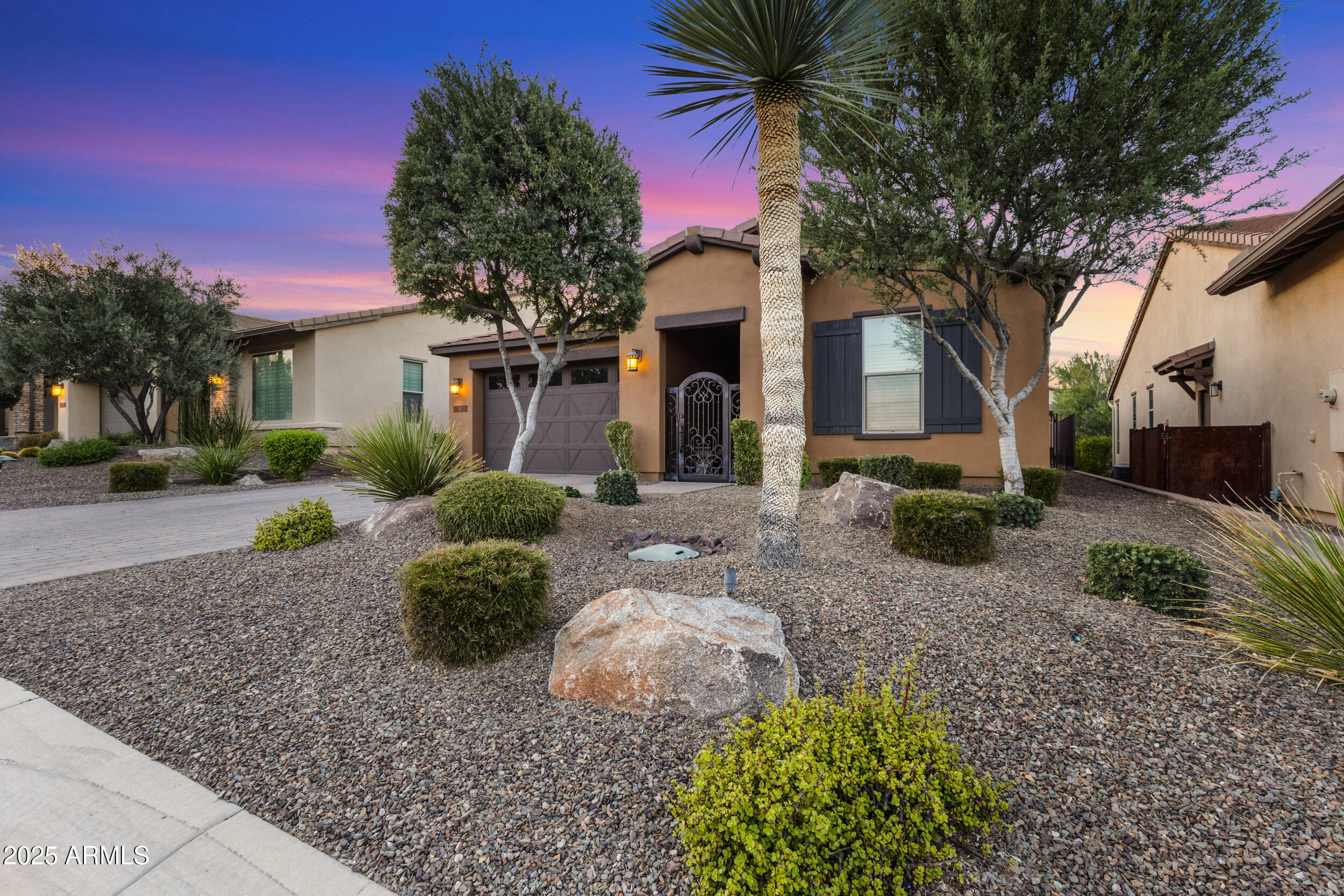 18068 East Curva De Plata Rio Verde, AZ 85263 - Photo 7 of 71 a front view of a house with a yard and garage