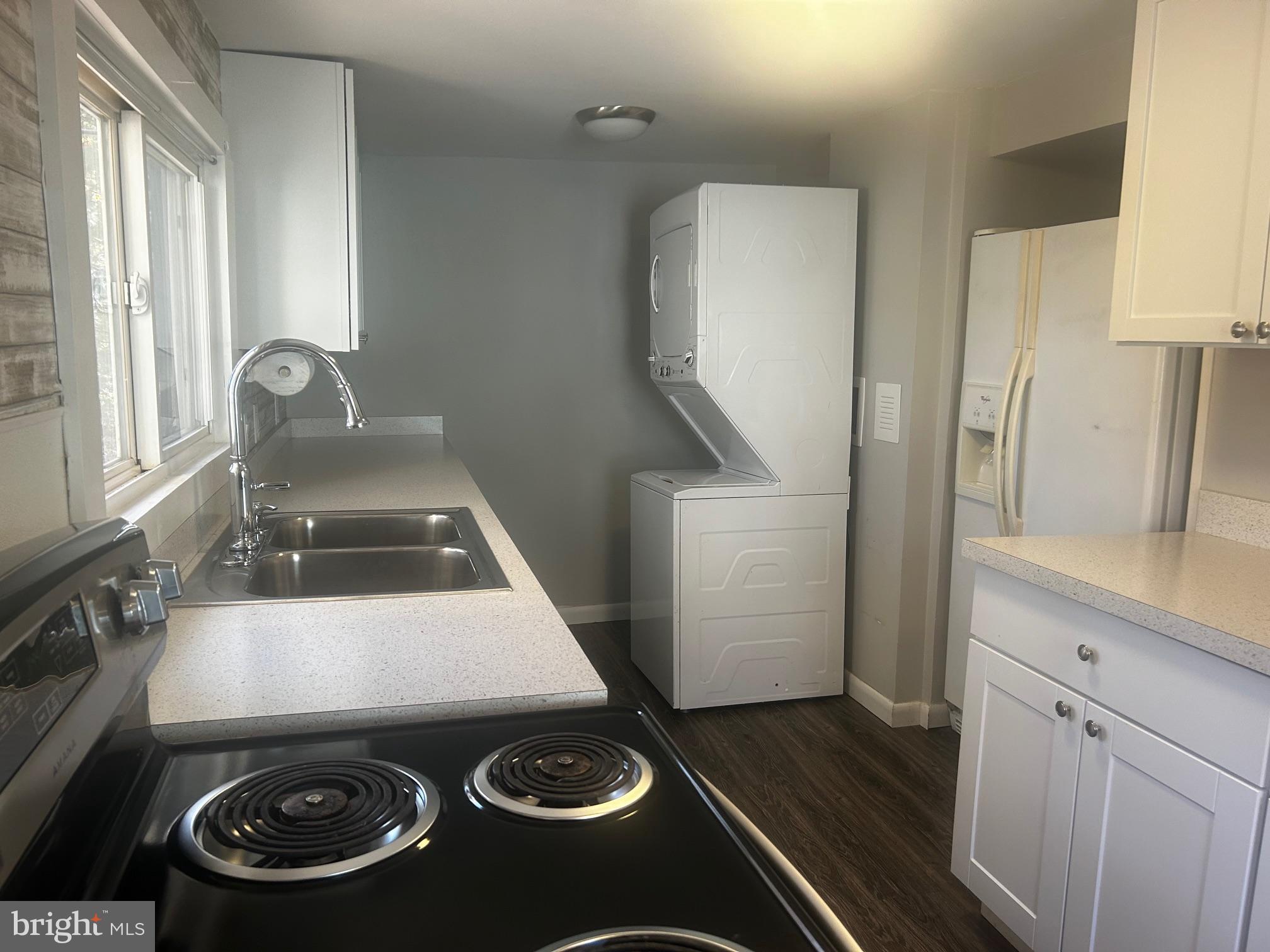 106 9th Avenue Pitman, NJ 08071 - Photo 6 of 14 a kitchen with a stove and a refrigerator