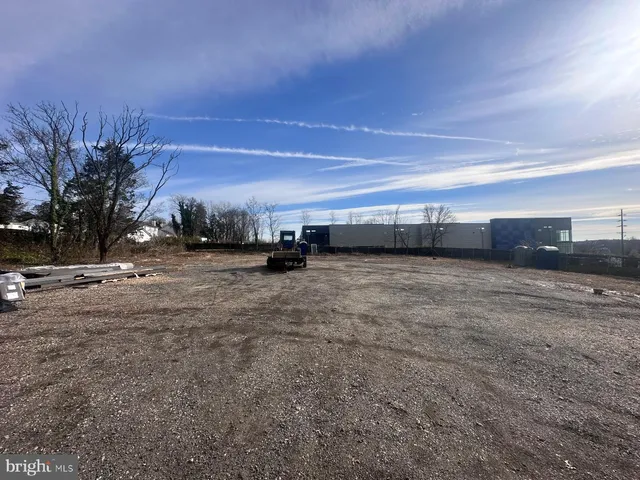 a backyard of a house with trees and houses