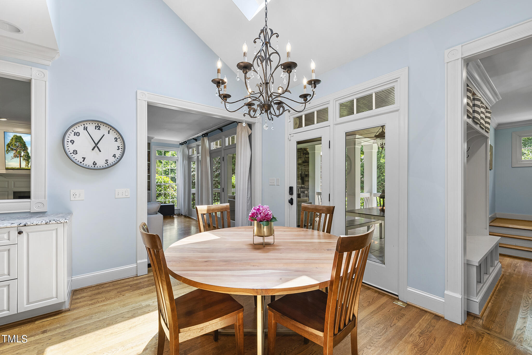 513 Lake Boone Trail Raleigh, NC 27608 - Photo 16 of 41 a view of a dining room with furniture a chandelier and wooden floor