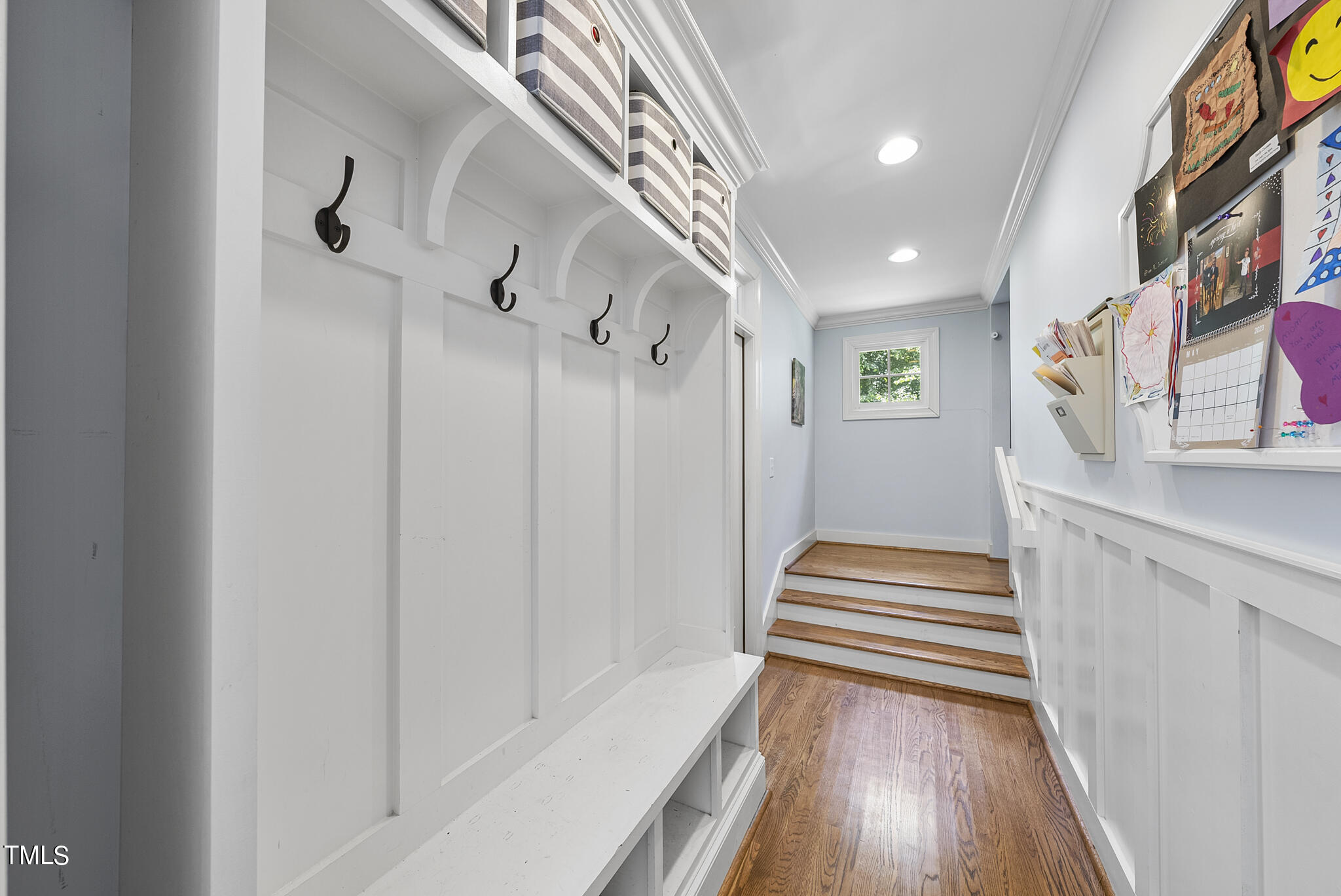 513 Lake Boone Trail Raleigh, NC 27608 - Photo 17 of 41 a view of a hallway with wooden floor and staircase