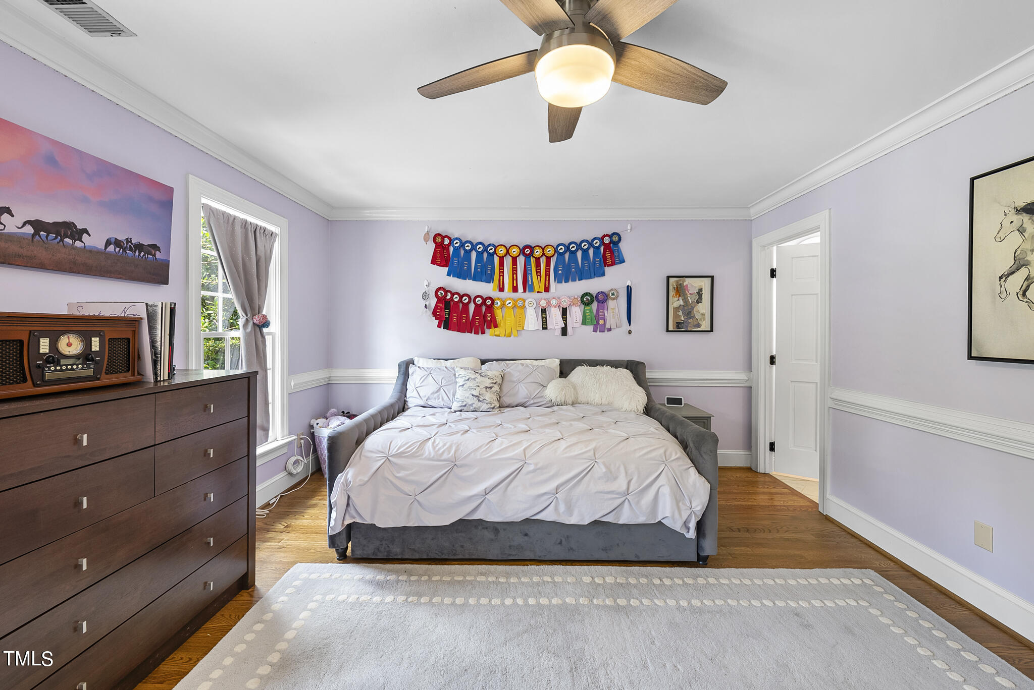 513 Lake Boone Trail Raleigh, NC 27608 - Photo 18 of 41 a bedroom with a bed dresser and wooden floor