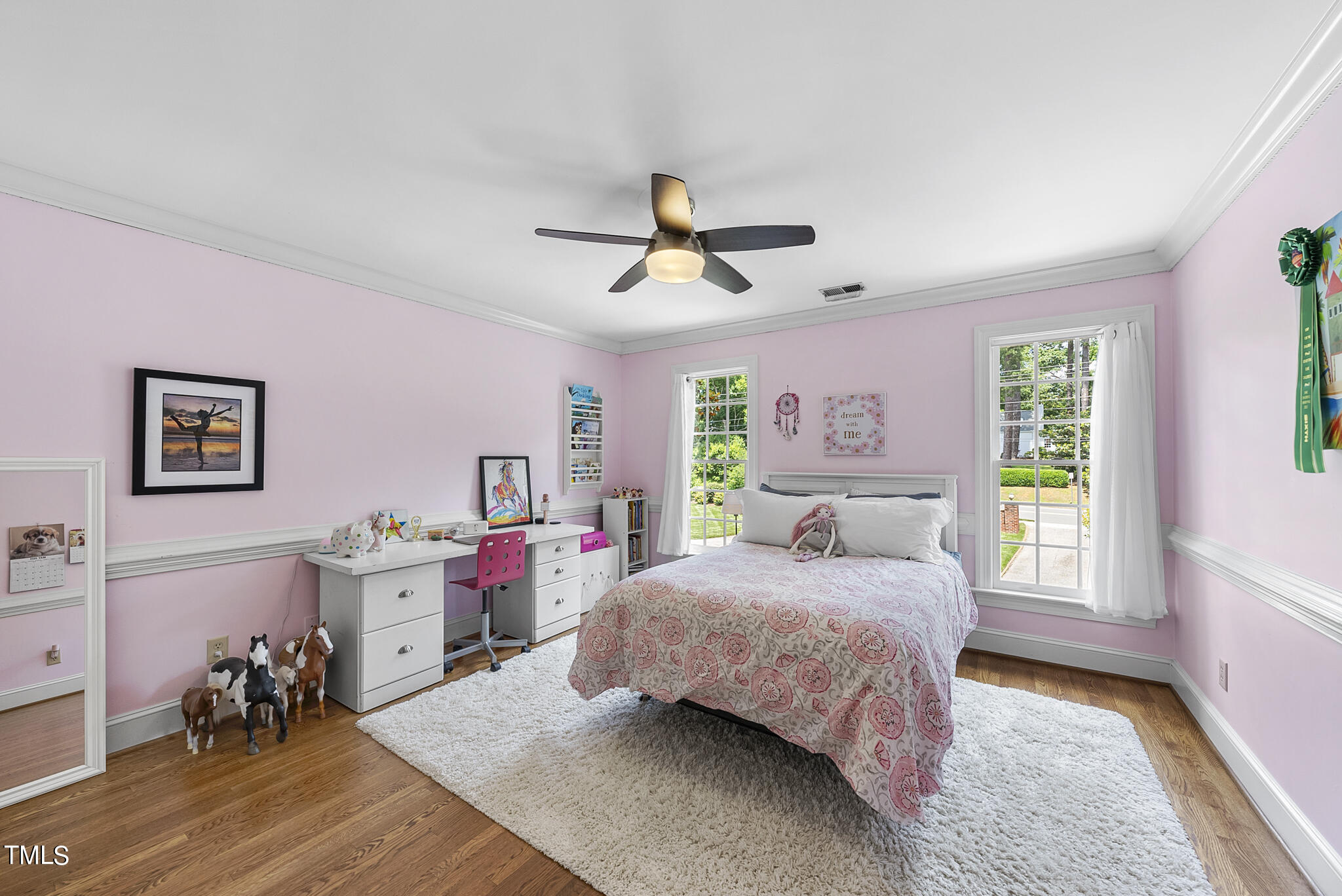 513 Lake Boone Trail Raleigh, NC 27608 - Photo 20 of 41 a bedroom with a bed and a chandelier