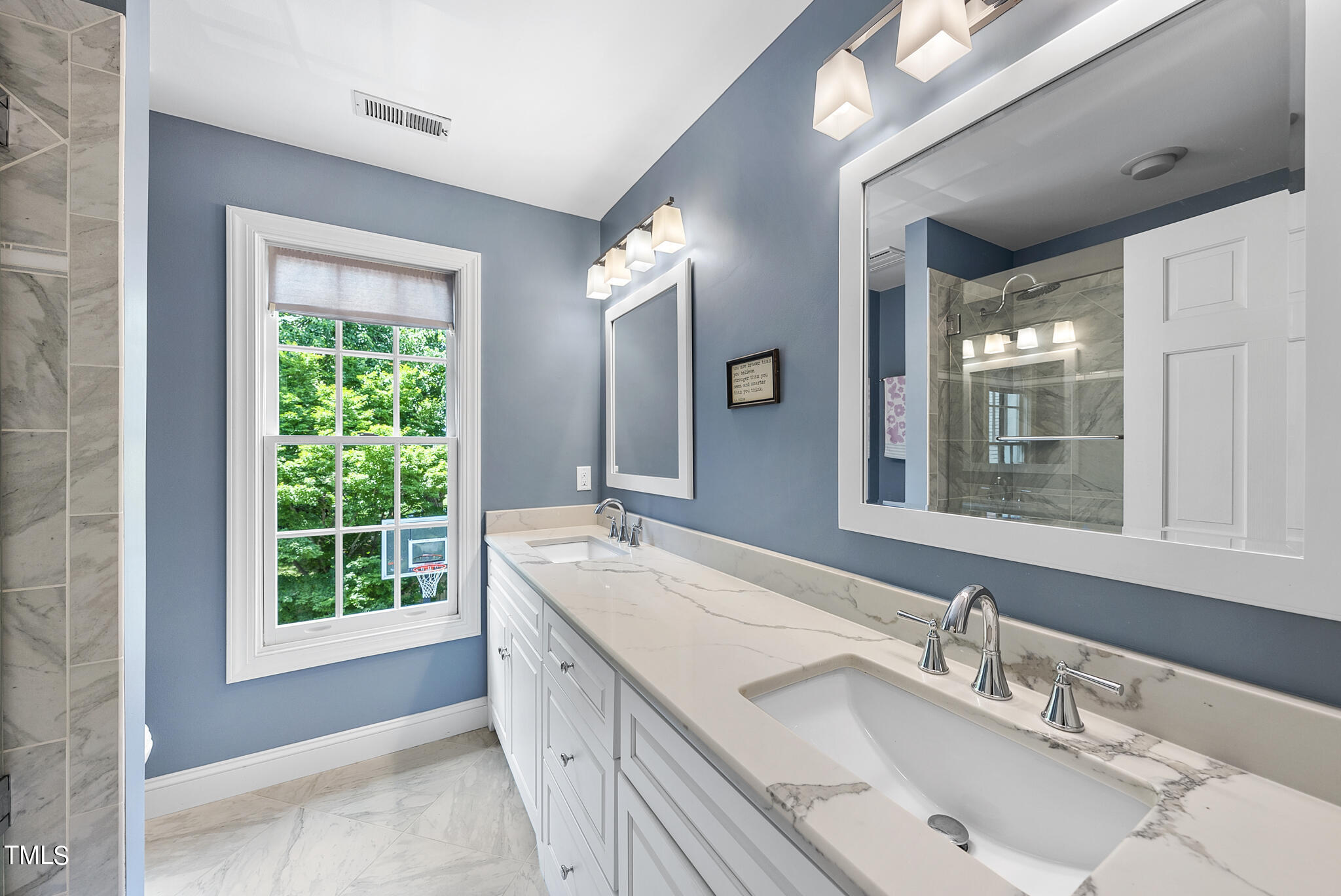 513 Lake Boone Trail Raleigh, NC 27608 - Photo 21 of 41 a bathroom with a granite countertop sink and a large mirror