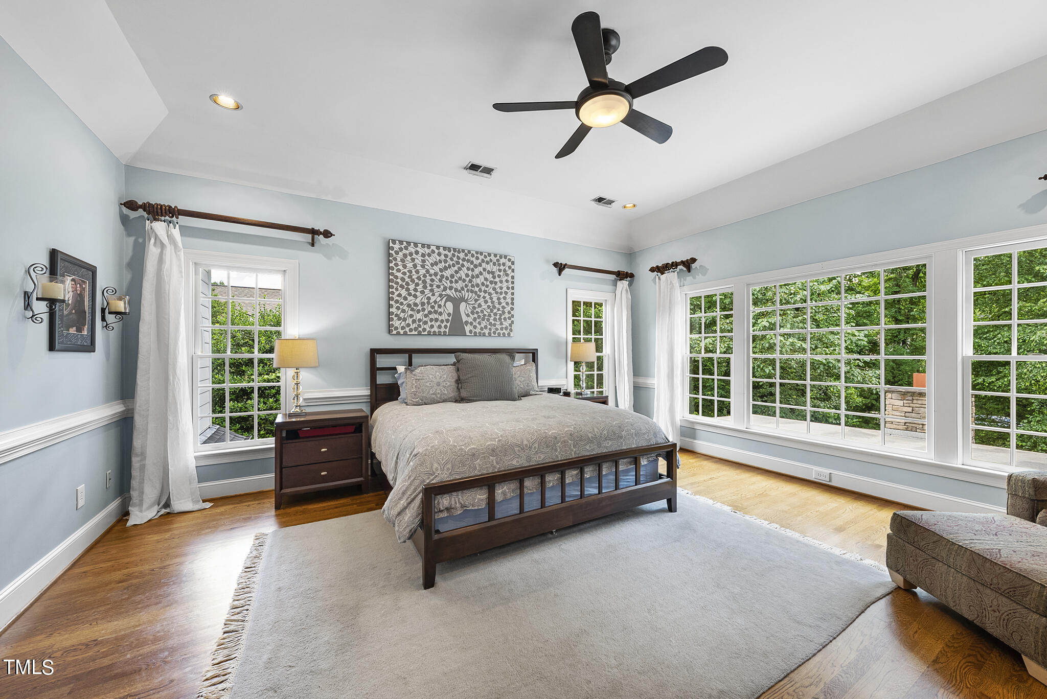 513 Lake Boone Trail Raleigh, NC 27608 - Photo 24 of 41 a spacious bedroom with a large bed and a large window