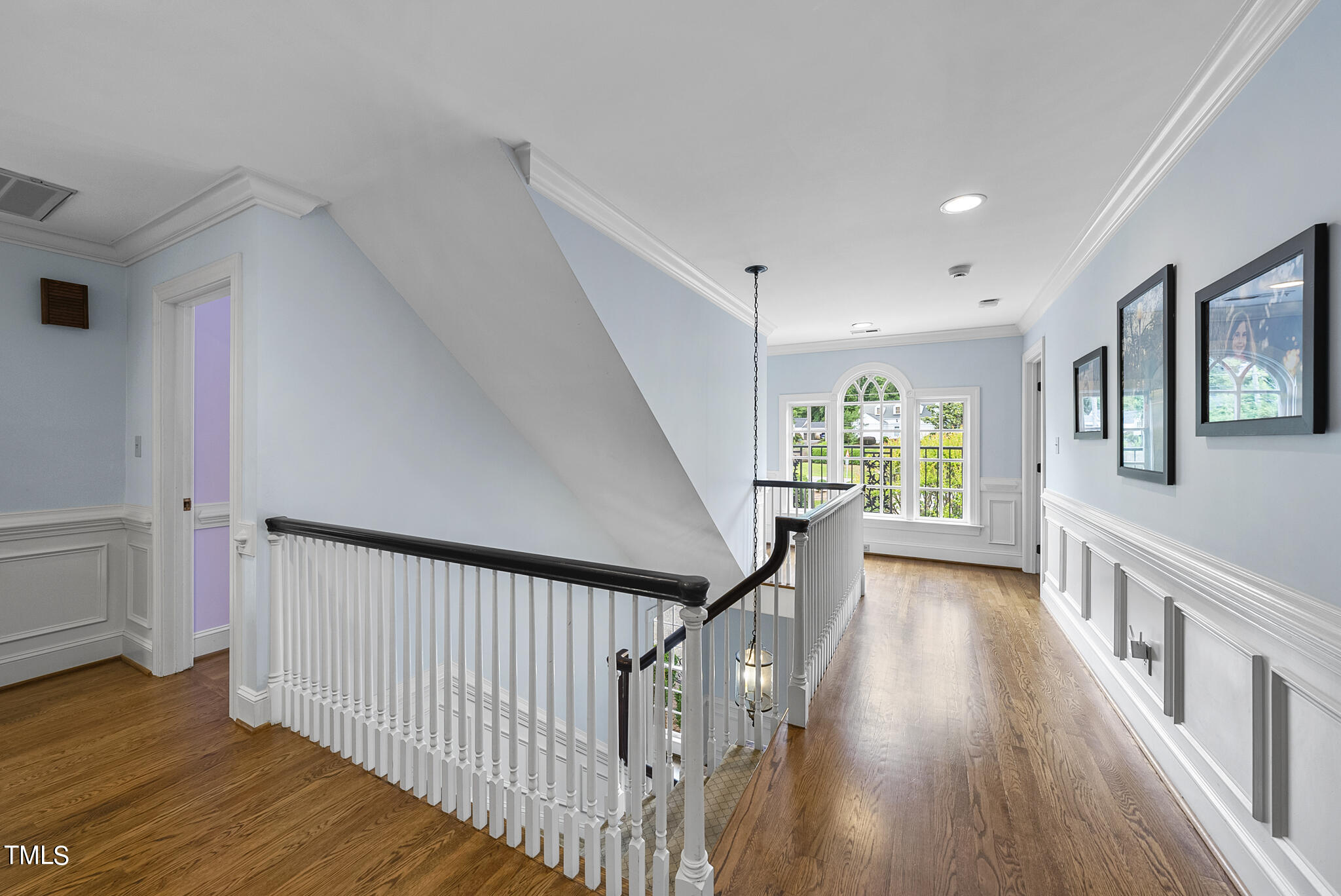 513 Lake Boone Trail Raleigh, NC 27608 - Photo 27 of 41 a view of a hallway with wooden floor and staircase