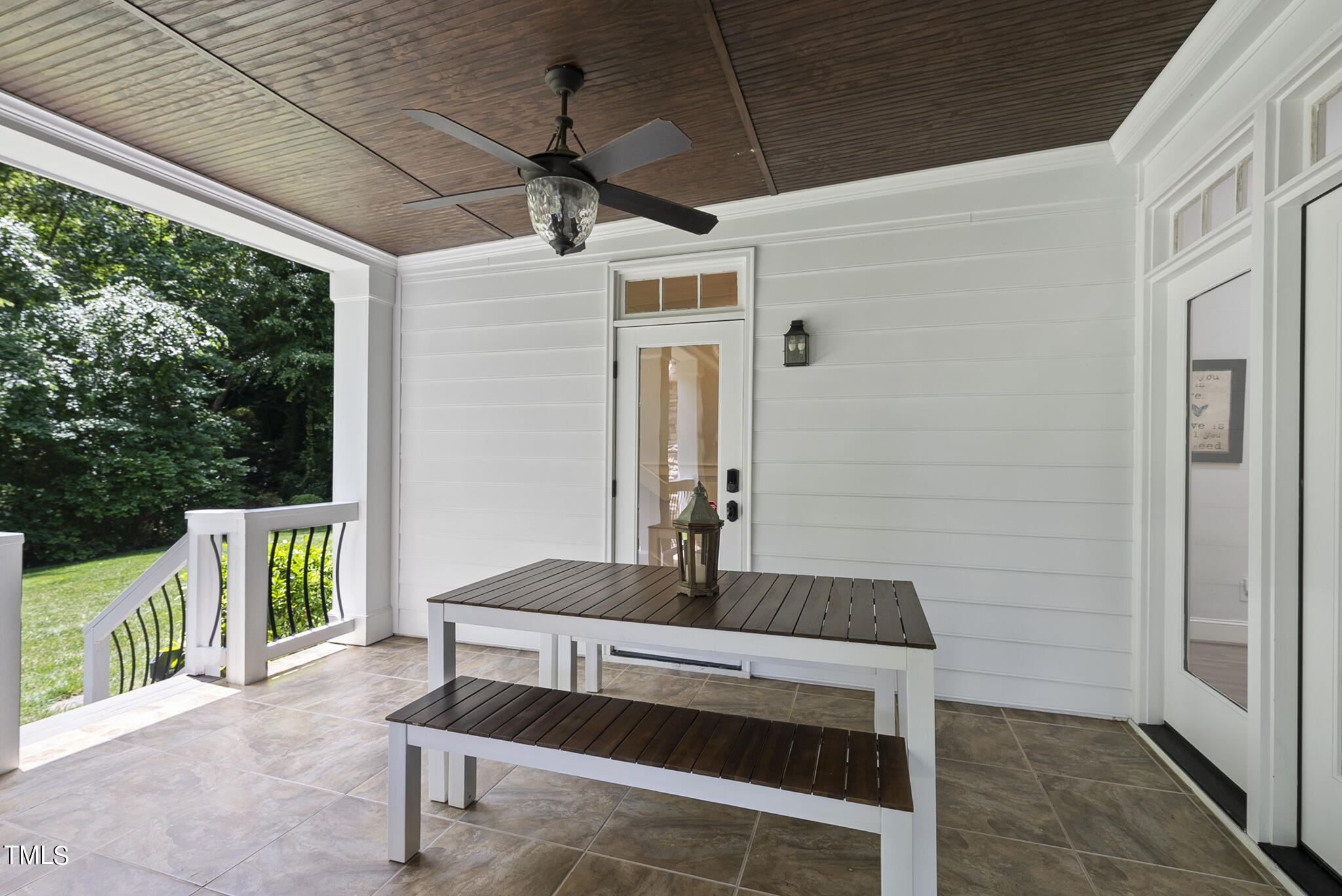 513 Lake Boone Trail Raleigh, NC 27608 - Photo 32 of 41 a roof deck with table and chairs and wooden floor