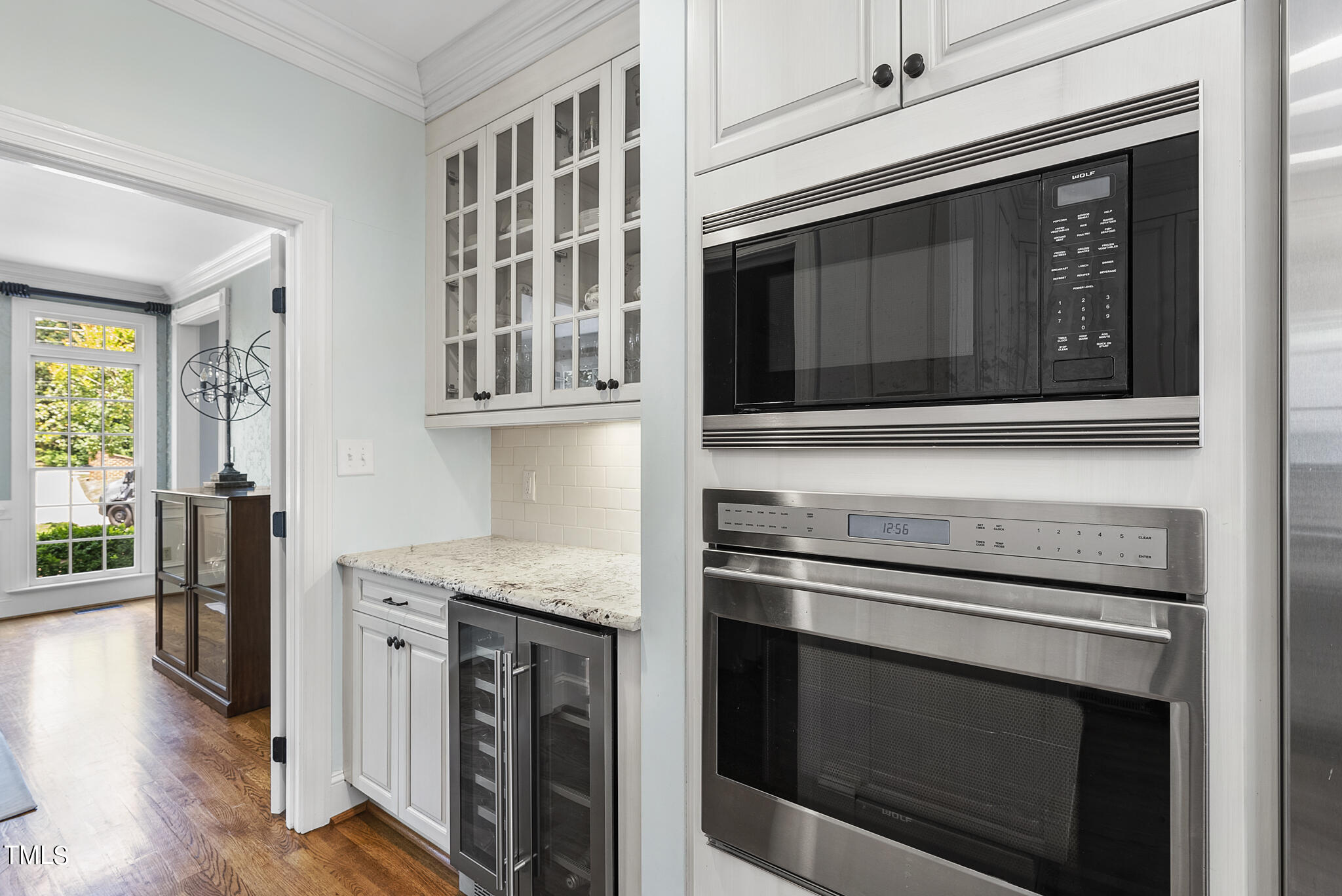 513 Lake Boone Trail Raleigh, NC 27608 - Photo 6 of 41 a kitchen with granite countertop cabinets stainless steel appliances and wooden floor