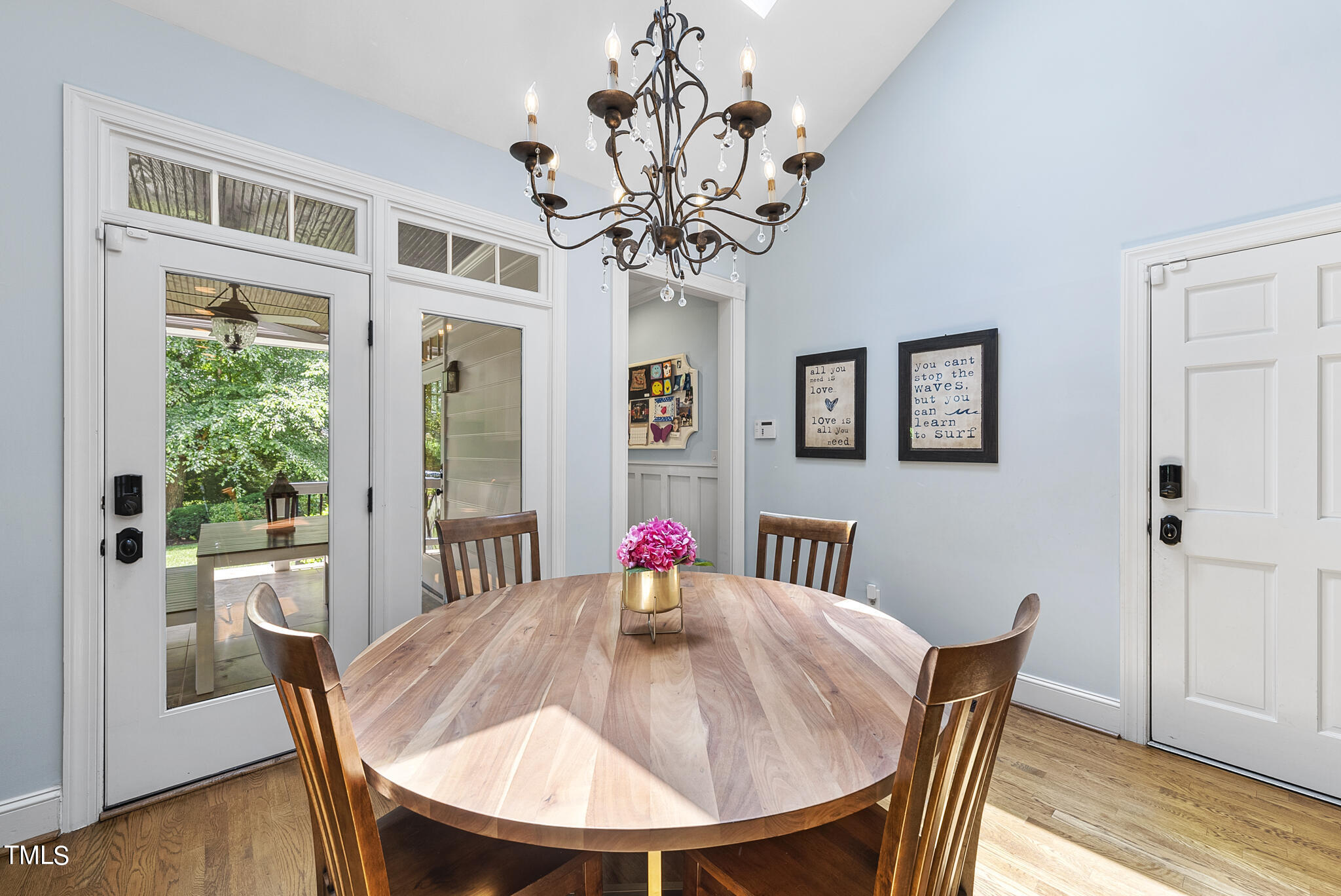 513 Lake Boone Trail Raleigh, NC 27608 - Photo 9 of 41 a view of a dining room with furniture wooden floor and chandelier