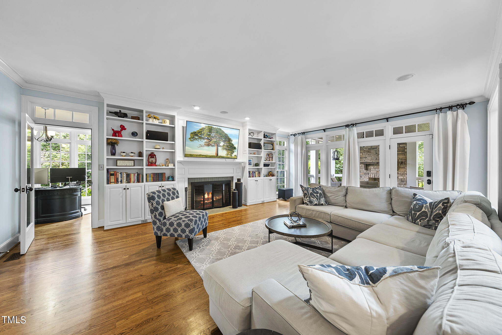 513 Lake Boone Trail Raleigh, NC 27608 - Photo 10 of 41 a living room with furniture fireplace and a large window