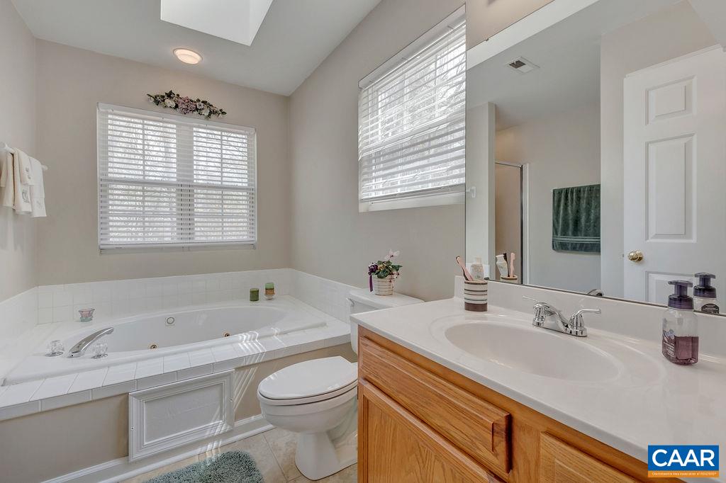 13 Stonewall Road Palmyra, VA 22963 - Photo 21 of 45 a bathroom with a granite countertop sink mirror bathtub and toilet