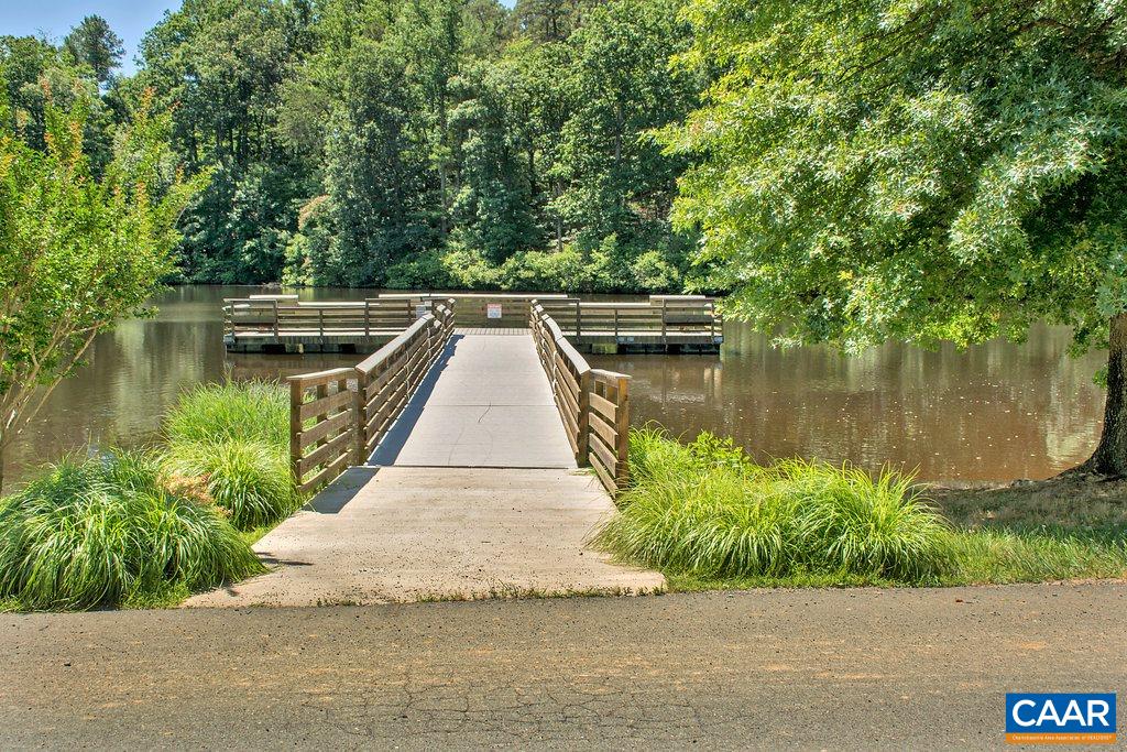 13 Stonewall Road Palmyra, VA 22963 - Photo 42 of 45 a view of a wooden deck and lake