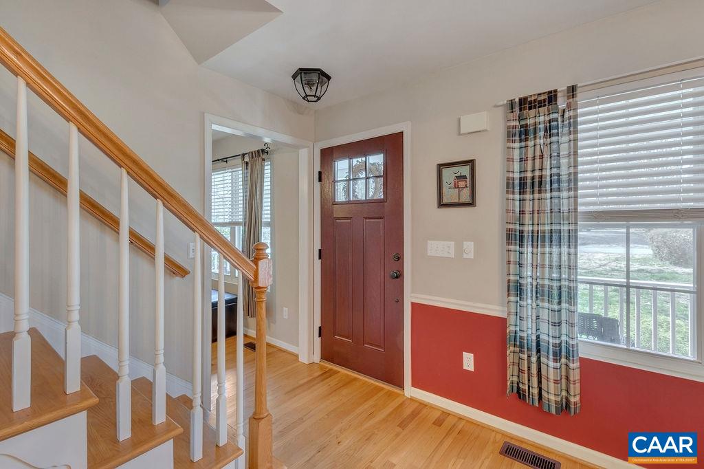 13 Stonewall Road Palmyra, VA 22963 - Photo 5 of 45 a view of a livingroom with wooden floor and stairs