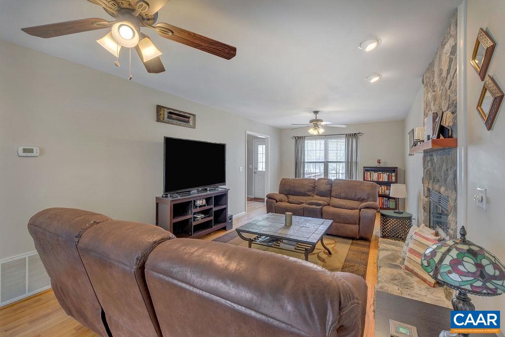 13 Stonewall Road Palmyra, VA 22963 - Photo 8 of 45 a living room with furniture and a flat screen tv