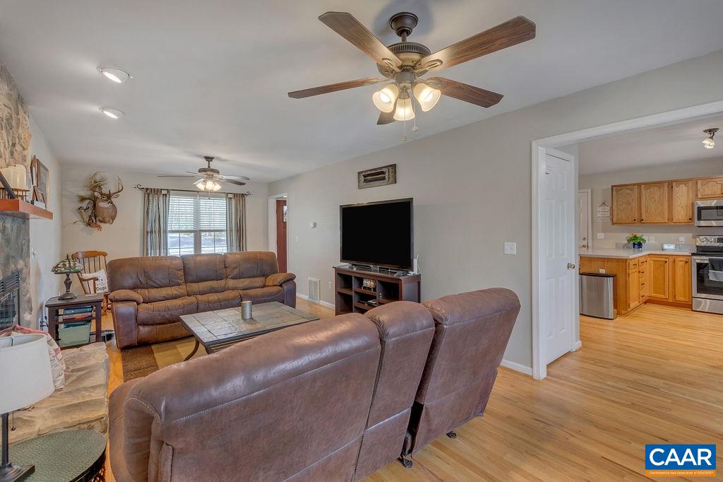 13 Stonewall Road Palmyra, VA 22963 - Photo 9 of 45 a living room with furniture and a flat screen tv