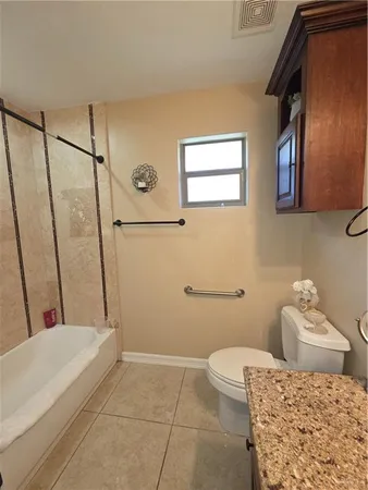 a spacious bathroom with a bathtub and a sink