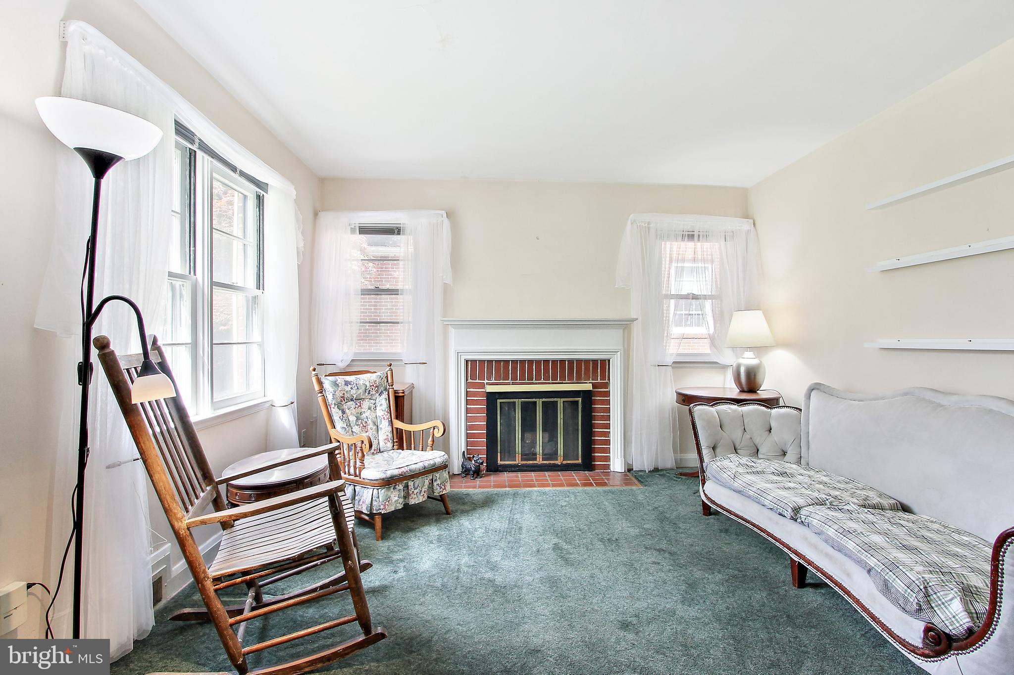 416 Milford Mill Road Baltimore, MD 21208 - Photo 6 of 24 Living room with cozy fireplace!