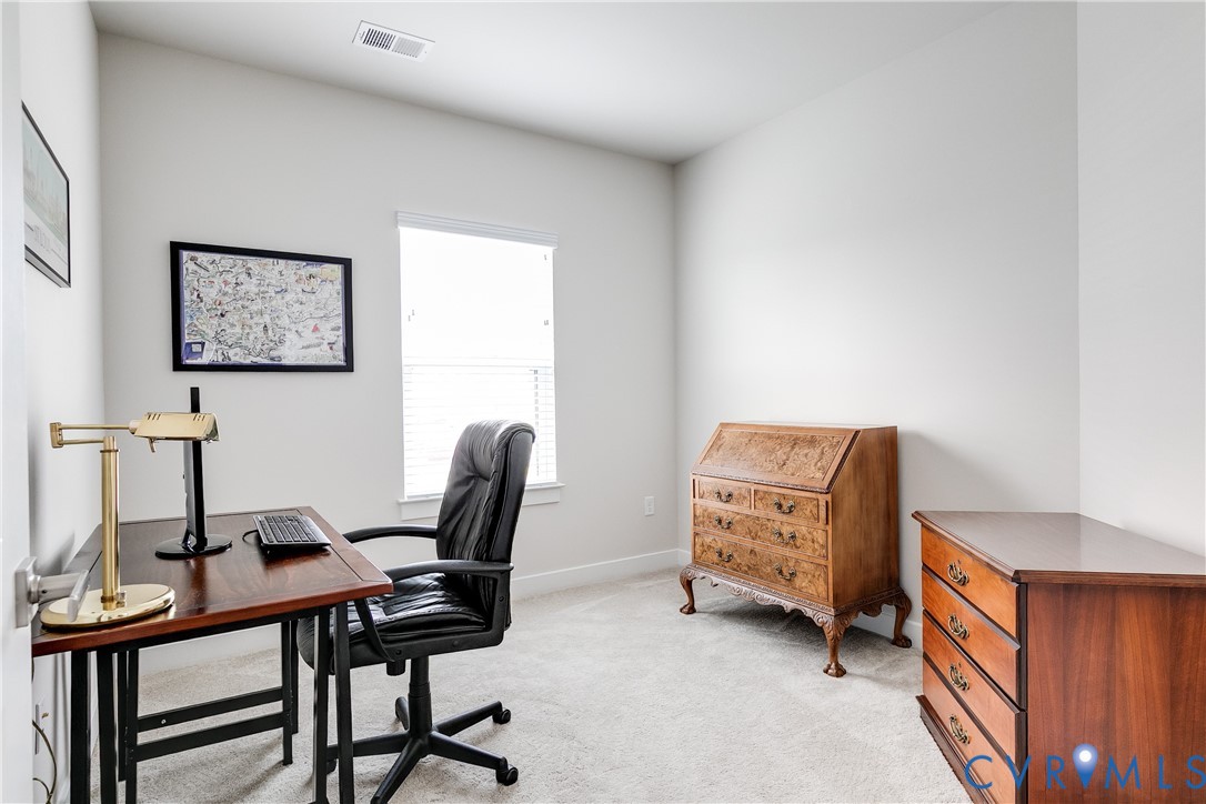 3900 Maze Runner Drive, Unit 206 Midlothian, VA 23112 - Photo 21 of 26 a view of a workspace with furniture and a window