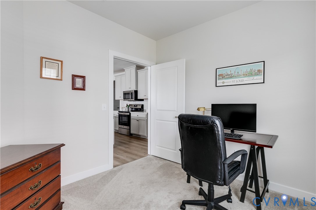 3900 Maze Runner Drive, Unit 206 Midlothian, VA 23112 - Photo 22 of 26 a view of a workspace with furniture and wooden floor