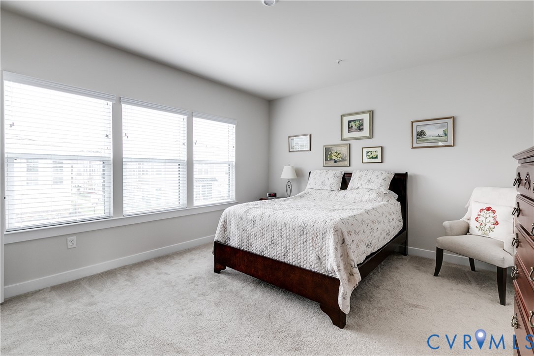 3900 Maze Runner Drive, Unit 206 Midlothian, VA 23112 - Photo 3 of 26 a spacious bedroom with a bed and a window