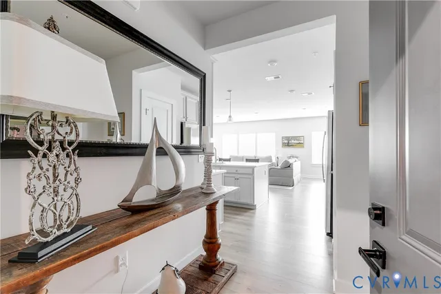 a view of living room with furniture and wooden floor