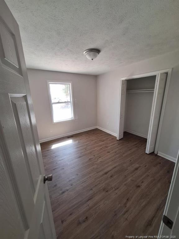 427 Jones Avenue Raeford, NC 28376 - Photo 11 of 15 an empty room with wooden floor and windows