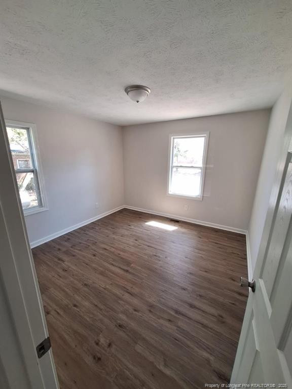 427 Jones Avenue Raeford, NC 28376 - Photo 13 of 15 wooden floor in an empty room with a window
