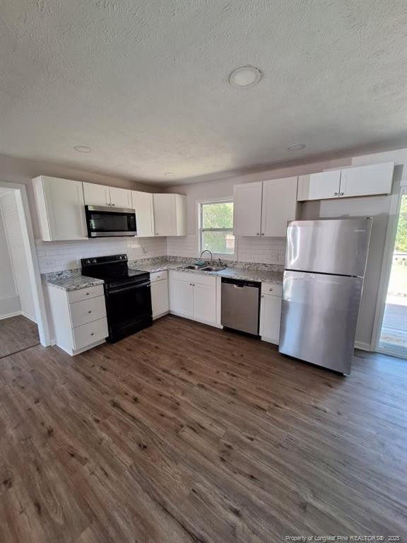 427 Jones Avenue Raeford, NC 28376 - Photo 5 of 15 a kitchen with a refrigerator and a stove top oven