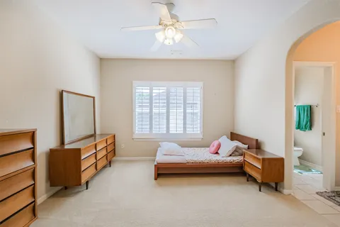 a bedroom with furniture and a window